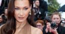 Bella Hadid a intors toate privirile pe covorul rosu de la Cannes 2024. Celebrul model a purtat o rochie transparenta, fara <span style='background:#EDF514'>SUTIEN</span>