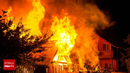 Un barbat si-a dat foc la casa pentru a-si ucide sotia si cei 7 copii. Ii tragea inapoi pe micutii care incercau sa scape