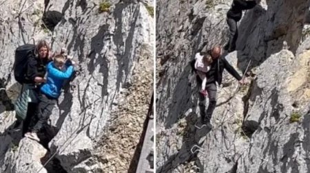 Tata filmat cu bebe<span style='background:#EDF514'>LUSU</span>l in brate, in adidasi si fara echipament de siguranta, pe un traseu periculos din Dolomiti, in Italia. Val de indignare pe net | VIDEO