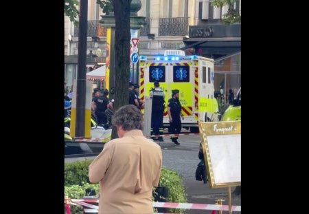 Politist atacat cu un cutit la Paris. <span style='background:#EDF514'>AGRESOR</span>ul, care a fost dat afara dintr-un magazin Luis Vuitton, impuscat de un alt agent
